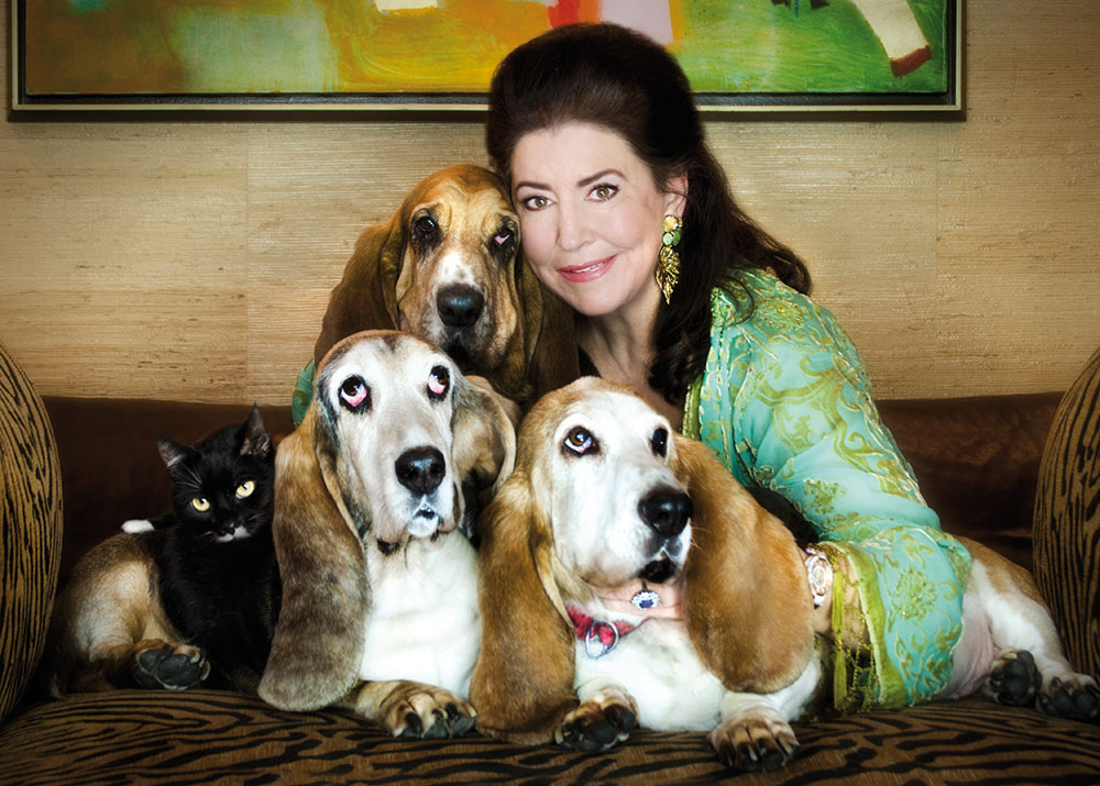 Carol Byers is seen in the photo with her rescued Basset Hounds Tiffany, Buffy, Humphrey and Katie Cat. Photo by Shlomit Schatzmayr. Photo by Shlomit Schatzmayr